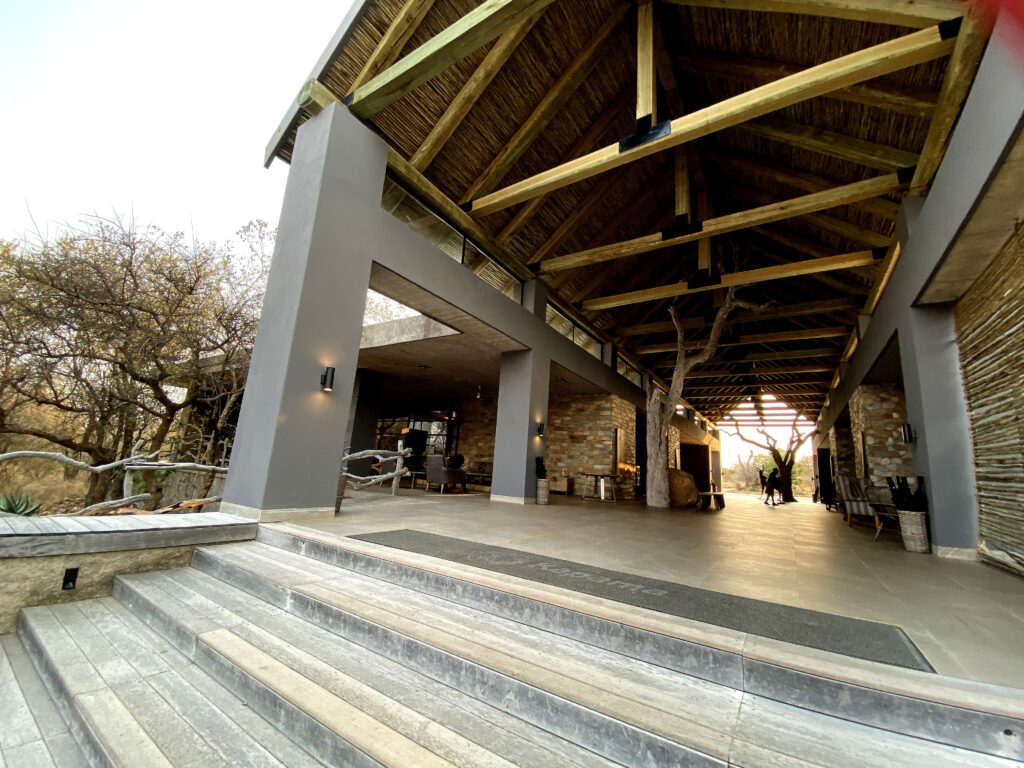 Open outdoor patio with high woven rooftop