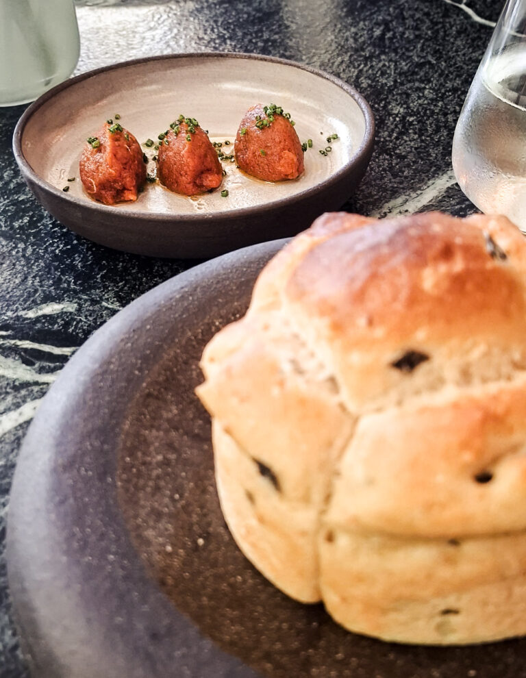 Starters with bread and delicious hake with chives